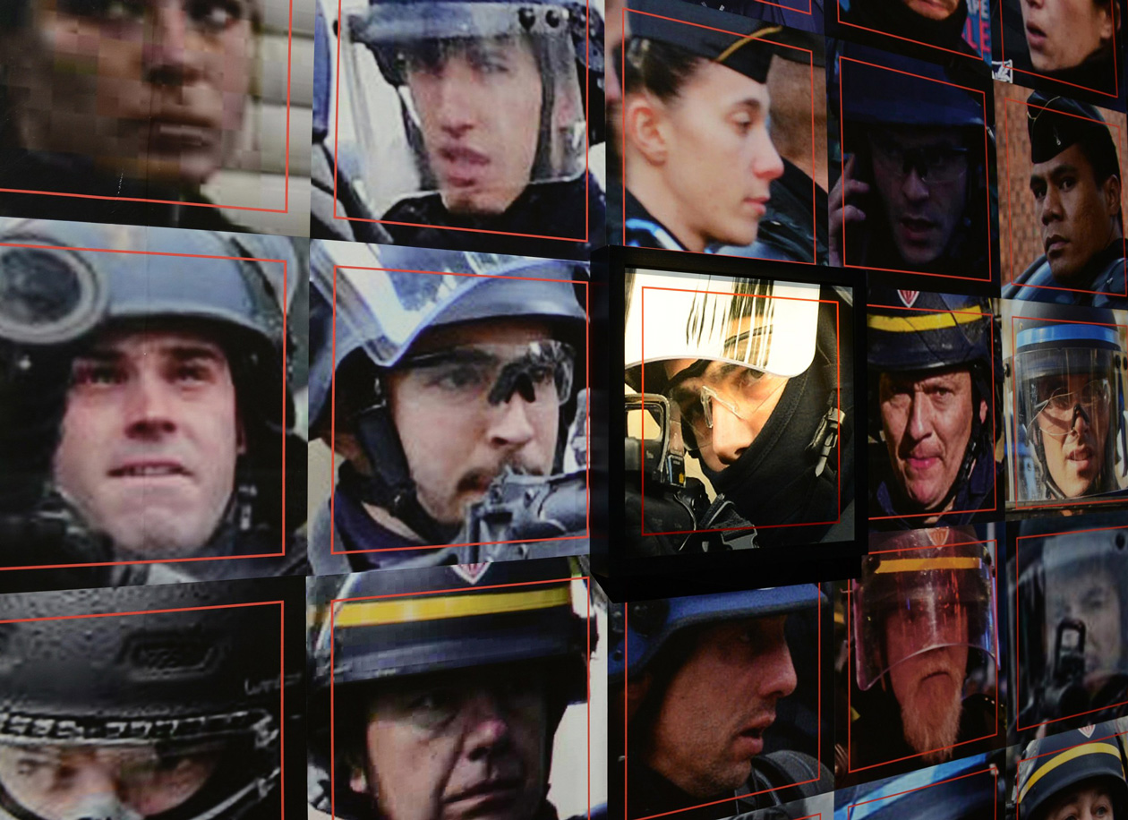 Detail of the installation for Capture, featuring headshots of French police officers. Image courtesy of Paolo Cirio. https://paolocirio.net/work/capture/ 